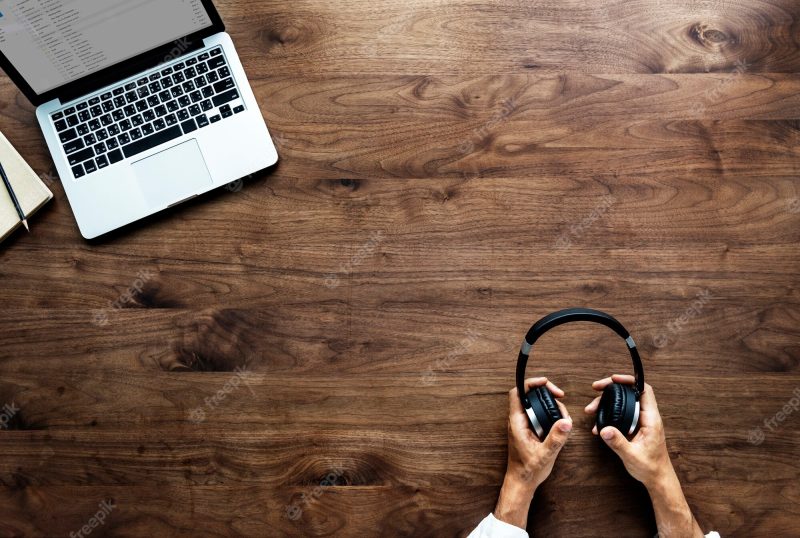 aerial-view-computer-laptop-wooden-table_53876-13429
